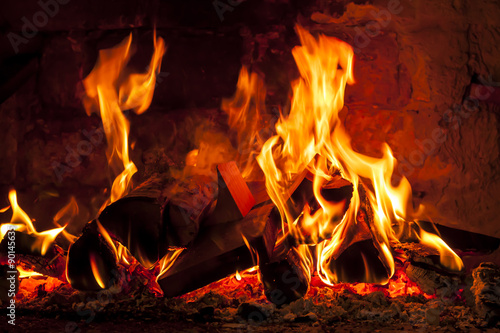 Fireplace with a blazing flames. photo