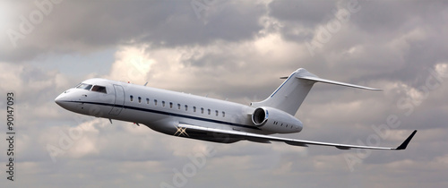 Close up of a private jet flying