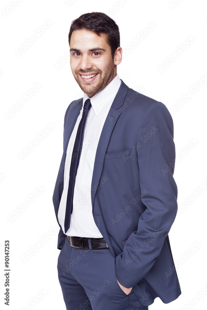 Smiling business man standing with hands on the pockets, isolate Smiling business man standing with hands on the pockets, isolate