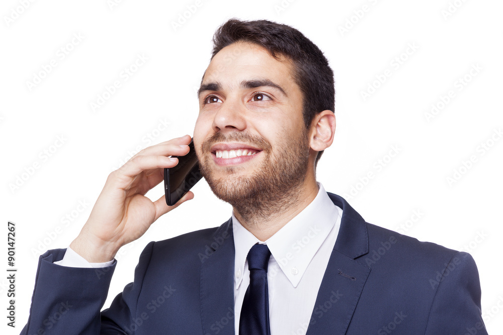 Smiling business man talking on the phone, isolated on white bac Smiling business man talking on the phone, isolated on white bac