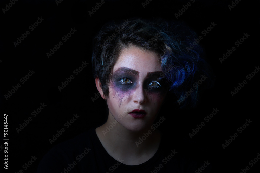 Girl in scary makeup on black background Girl in scary makeup on black background