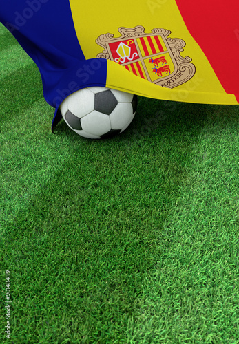 Soccer ball and national flag of Andora   green grass
