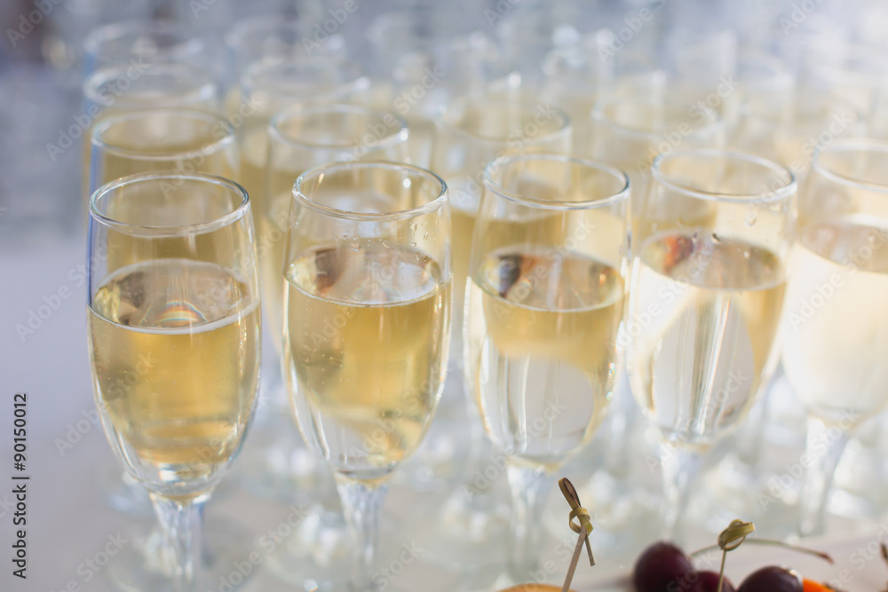 Beautiful row line of different colored alcohol cocktails with mint on a open air party, tequila, martini, vodka with bubbles,and others on decorated catering bouquet table on open air event, picture Beautiful row line of different colored alcohol cocktails with mint on a open air party, tequila, martini, vodka with bubbles,and others on decorated catering bouquet table on open air event, picture