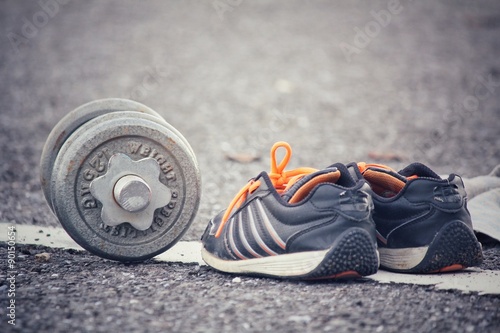 Sports set of sneakers with dumbbells