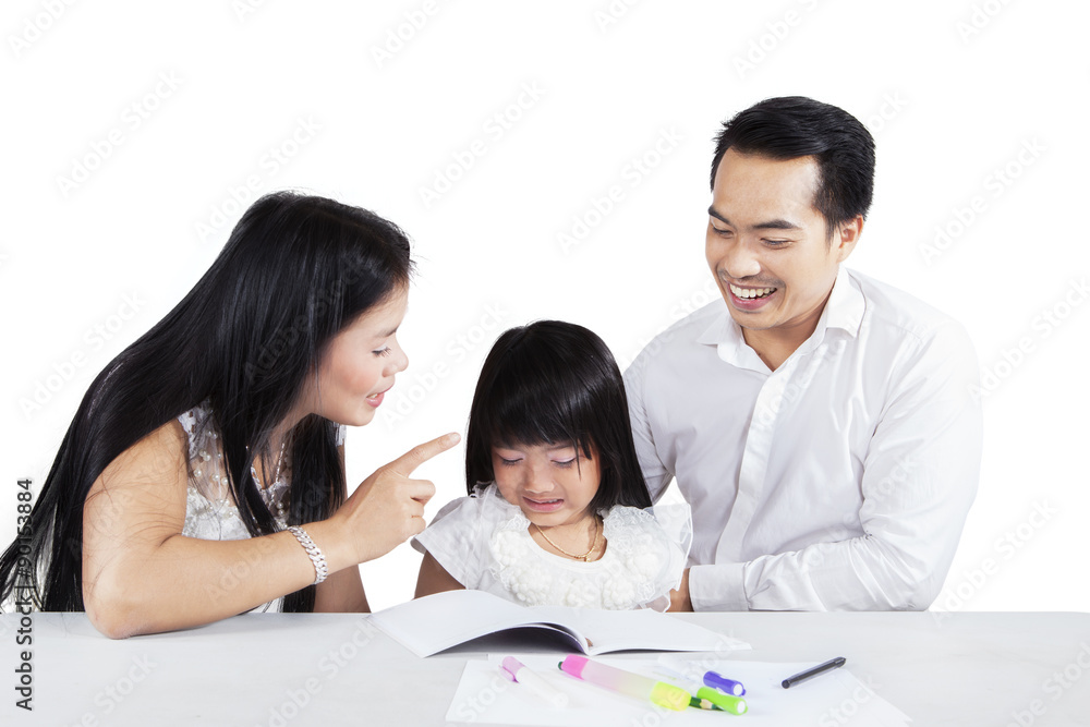 Hispanic mother scolding her child for studying Hispanic mother scolding her child for studying