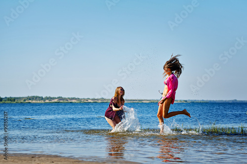 Best friends squirting in the river.