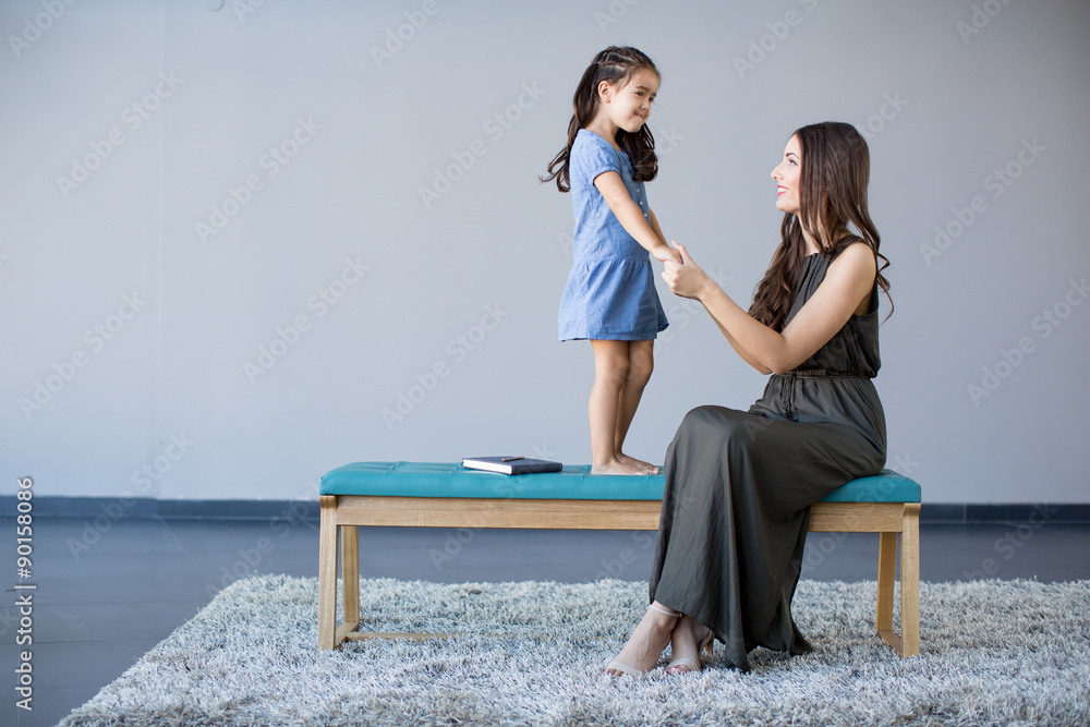 Young woman and little girl Young woman and little girl