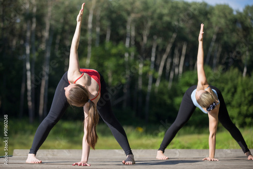 Yoga class: trikonasana pose