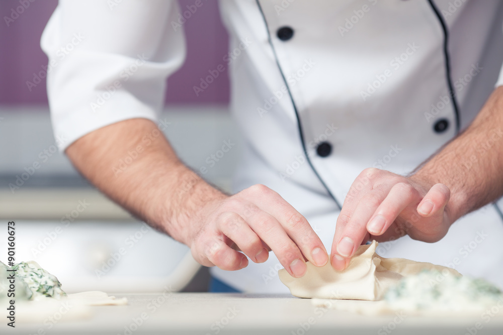 Vegetarian bakery concept. Chef cook in uniform putting filler