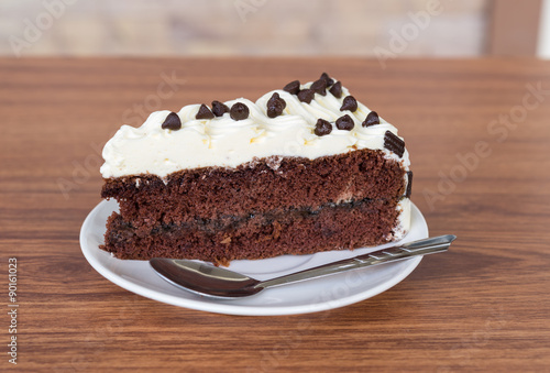 portion of cake on wooden table