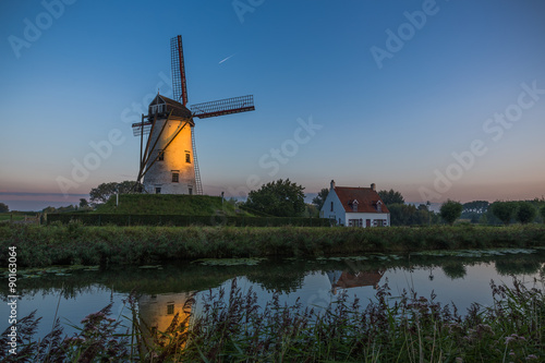 Sunrise over windmill in Damme, Belgium photo