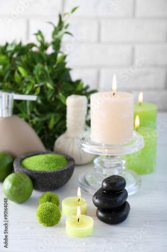 Beautiful composition of spa treatment on white wooden table