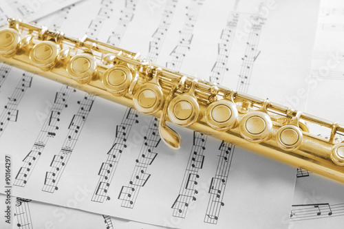 Flute on music notes background