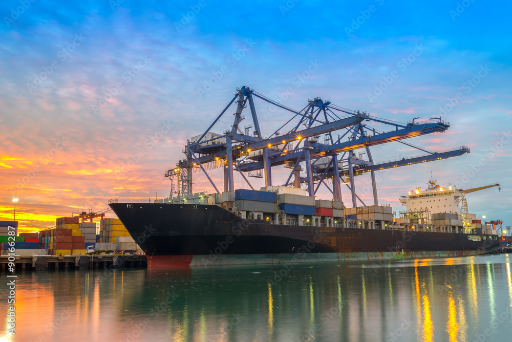 Cargo ship loading containers at sunshine