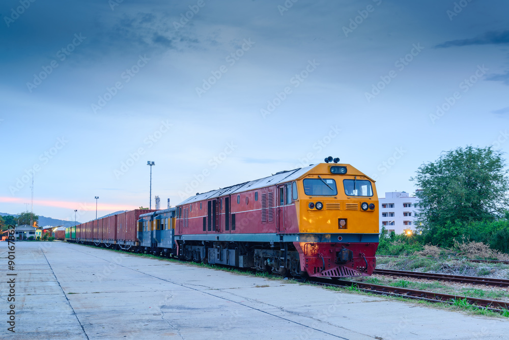 Fototapeta premium Cargo freigt train railroad station at dusk