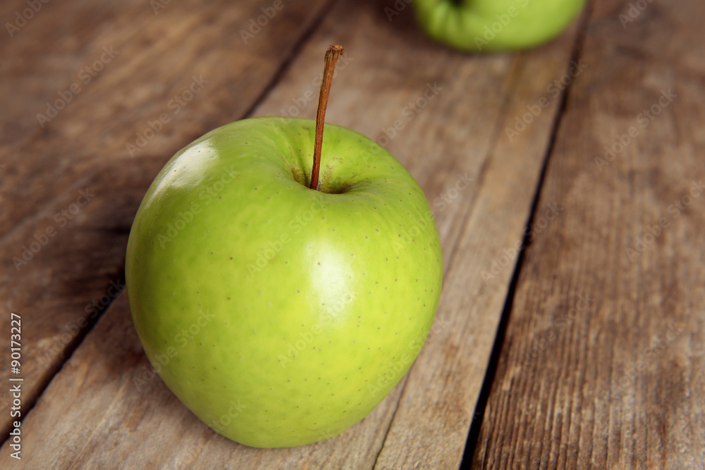 Ripe green apples on wooden table close up Ripe green apples on wooden table close up