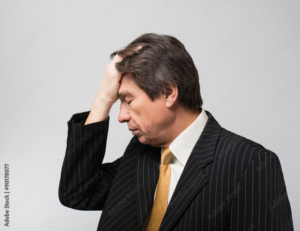 man holding his hand on the head of despair man holding his hand on the head of despair