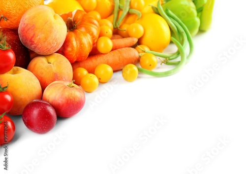 Heap of fresh fruits and vegetables  isolated on white