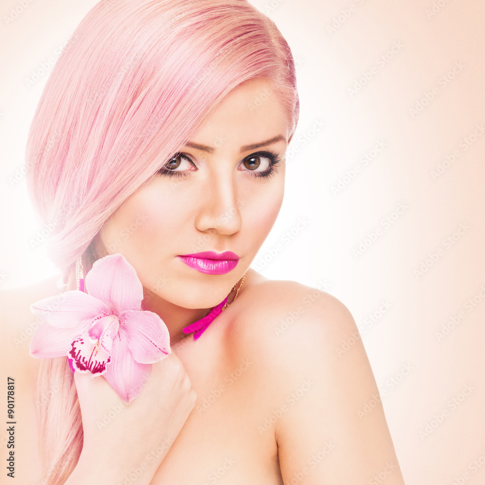 Beautiful young woman with pink hair and orchid Beautiful young woman with pink hair and orchid