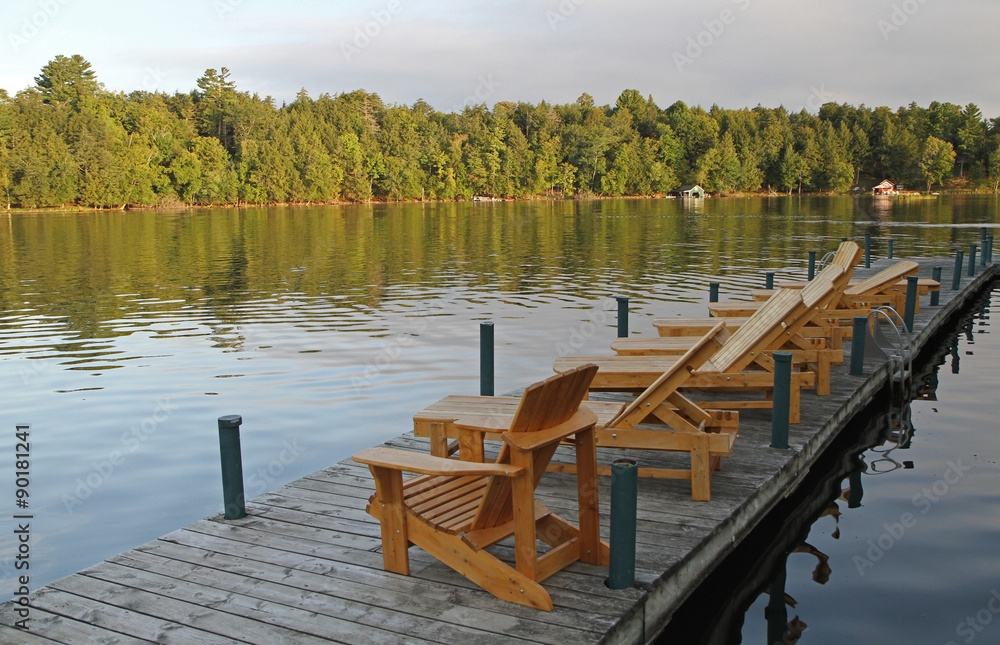 Naklejka premium Wilderness Lake Pier with Deck Chairs