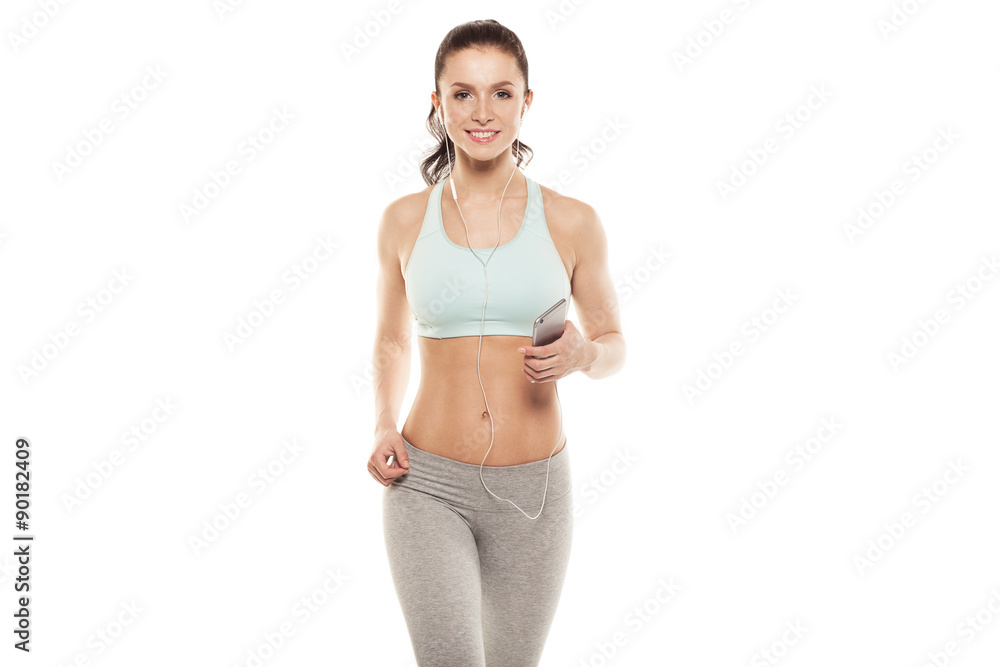 fitness girl with a smartphone on a white background, enjoys sports training, gym workout fitness girl with a smartphone on a white background, enjoys sports training, gym workout