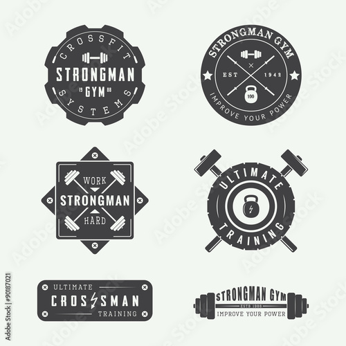 Set of gym logos, labels and slogans in vintage style