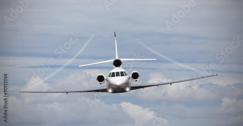 Frontal view of a private jet in midair