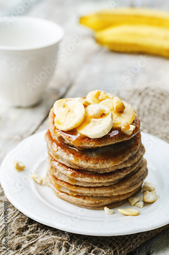 banana cashew pancakes with bananas and salted caramel sauce