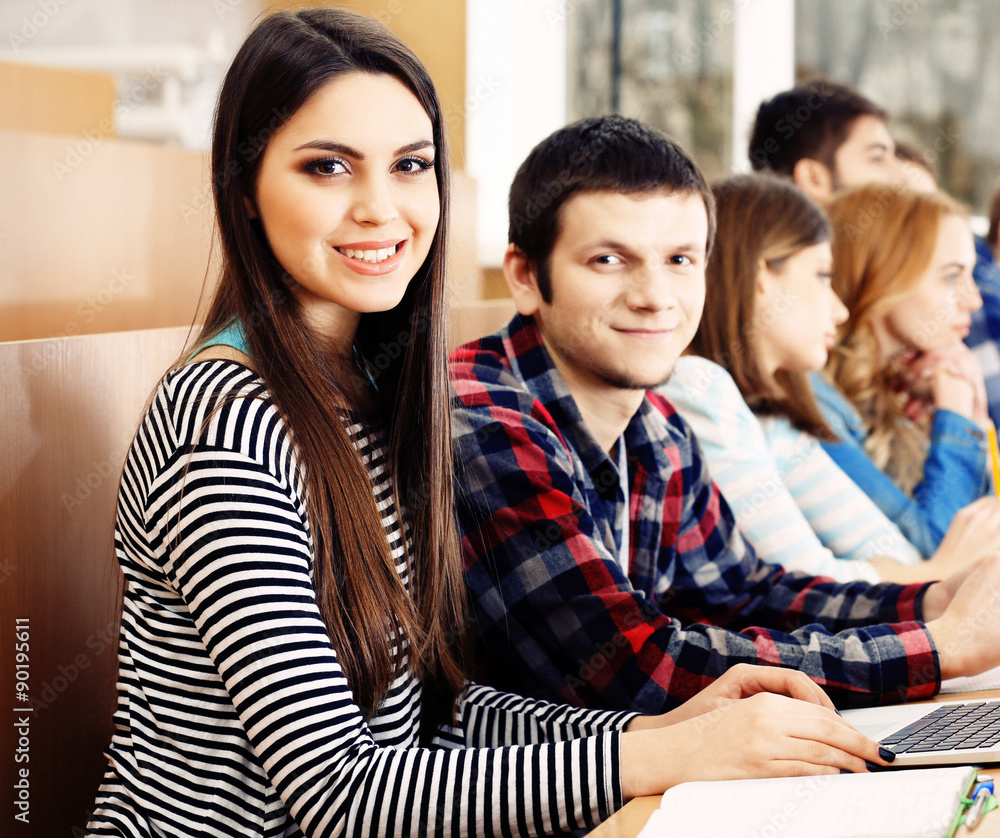 Group of students sitting in classroom Group of students sitting in classroom