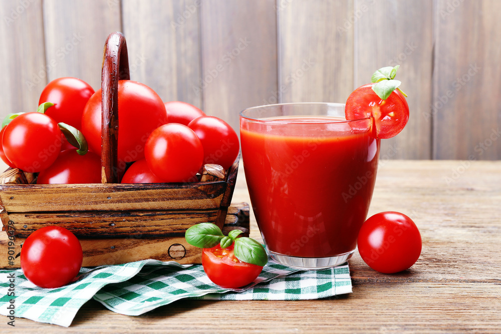 Glass of tomato juice with vegetables on wooden background Glass of tomato juice with vegetables on wooden background