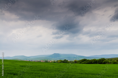 green field and storm © klagyivik
