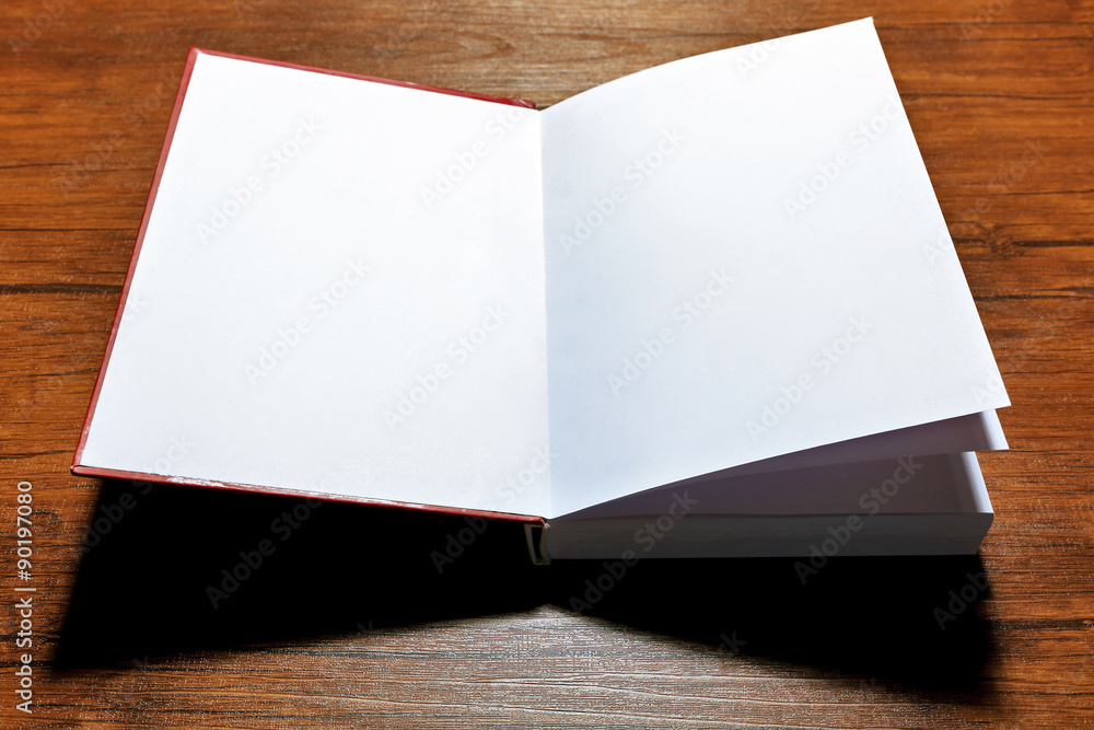 Fototapeta premium Blank book on wooden background