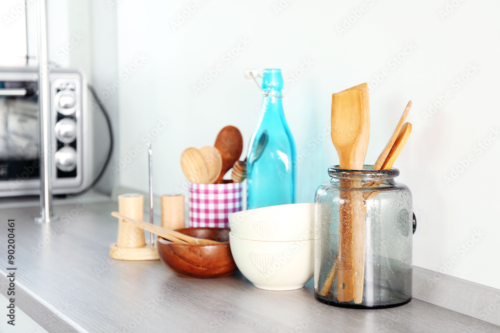 Composition with different utensils on wooden wooden table in kitchen