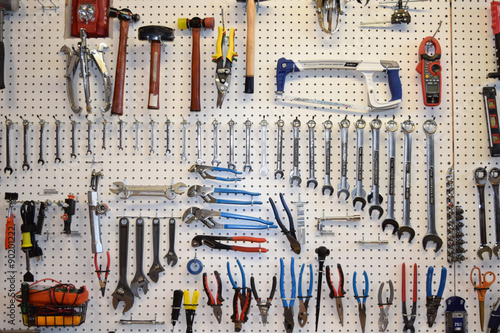 Tools hanging on a pegboard photo