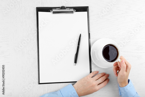 Obraz na płótnie Hands working in the office with documents on white table