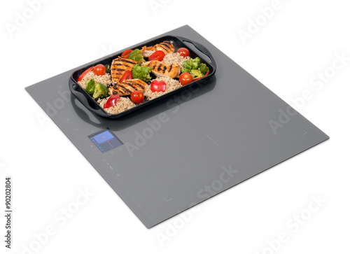 Gray induction hob with touch control panel isolated on white.