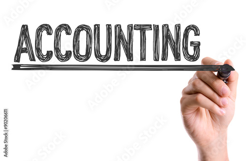 Hand with marker writing the word Accounting