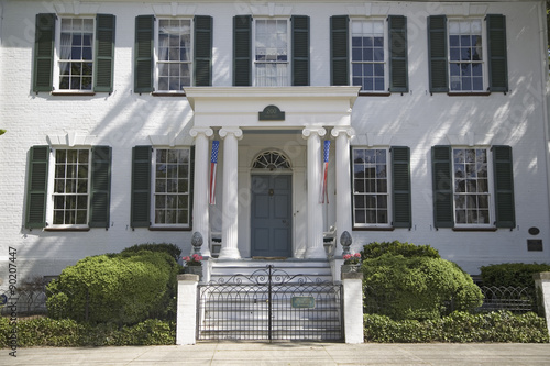 Green shutters on a white house in Pocomoke City, the Eastern Shore of Maryland photo