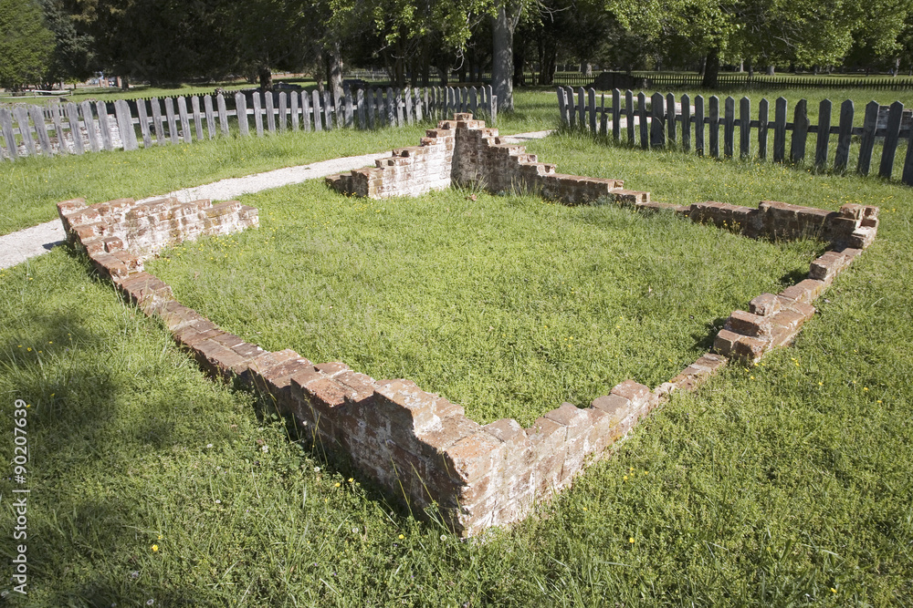 Obraz premium Early house foundations from the New Towne site of Jamestown, Jamestown Island, America's Birthplace, Virginia, built after 1620, the very first Main Street of America. Photo taken on 400th anniversary of Jamestown, the First Permanent English Settlement.