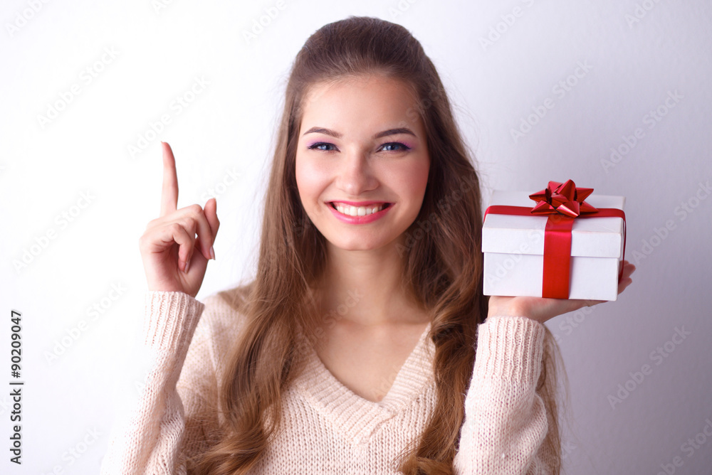 Young woman happy smile hold gift box in hands,standing over Young woman happy smile hold gift box in hands,standing over