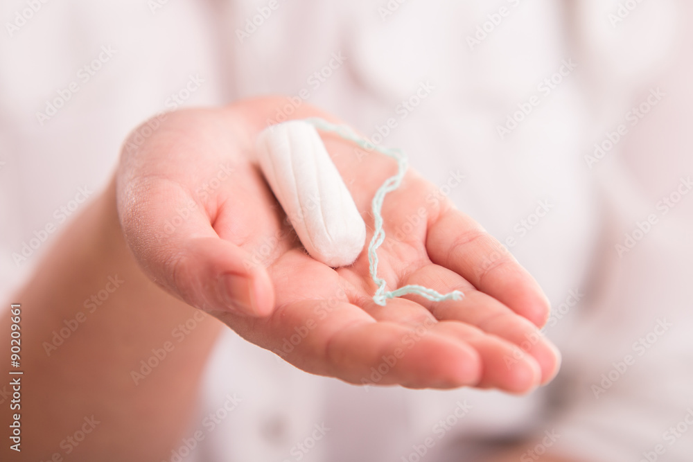 White woman's tampon on hand Stock-Foto | Adobe Stock
