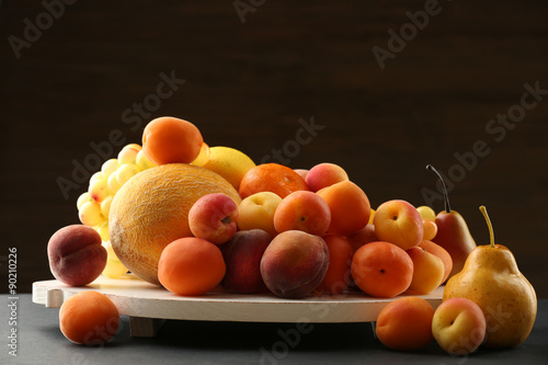 Heap of fresh fruits on dark background