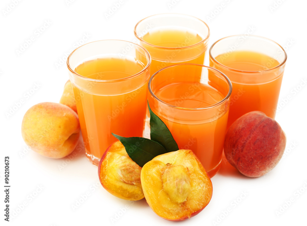 Peach juice in glass isolated on white Peach juice in glass isolated on white