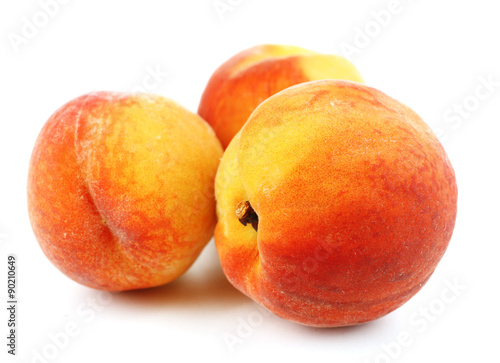 Ripe peaches isolated on white