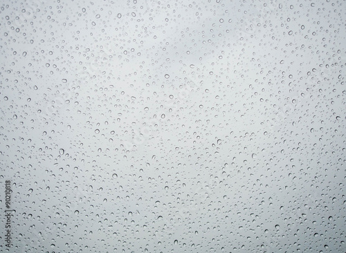 Many of raindrops stuck on the windshield background,Abstract of raindrops on the mirror.