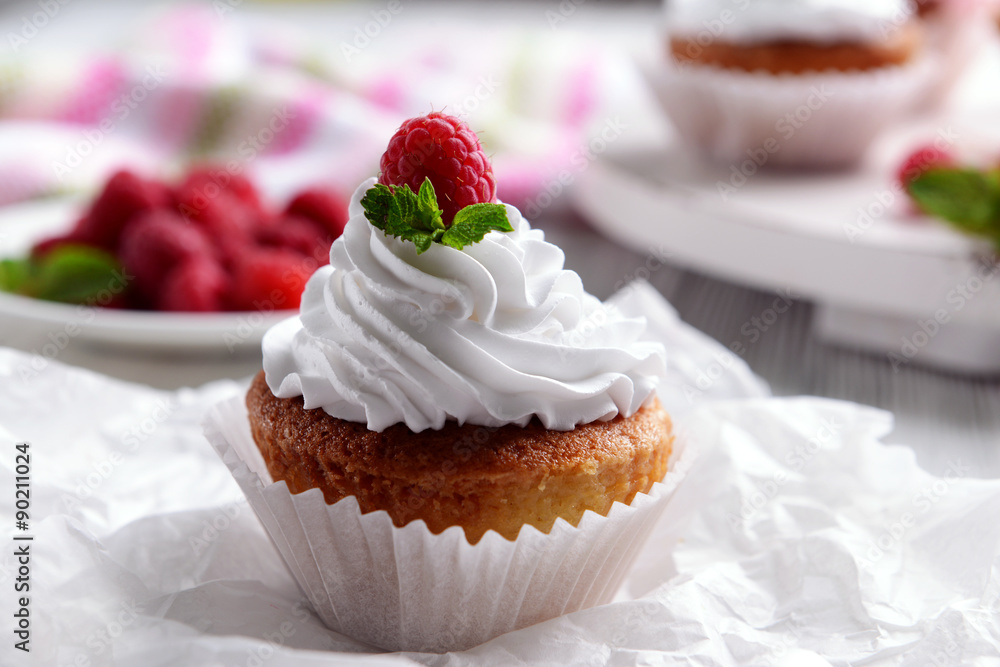 Delicious cupcake with berries on table close up Delicious cupcake with berries on table close up