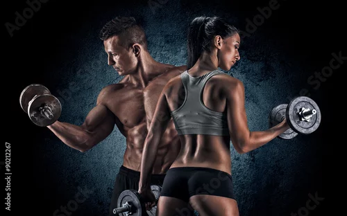Obraz Sportowy mężczyzna i kobieta z hantle.
