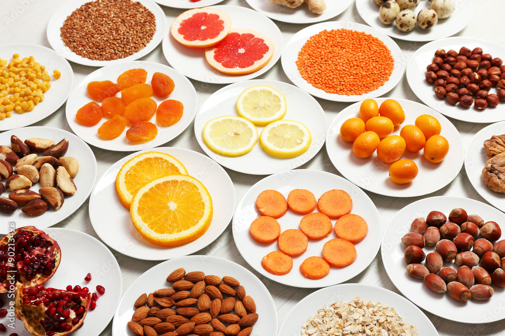 Set of orange products on wooden table, closeup Set of orange products on wooden table, closeup