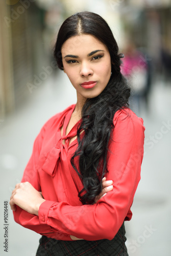 Hispanic stewardess in urban background