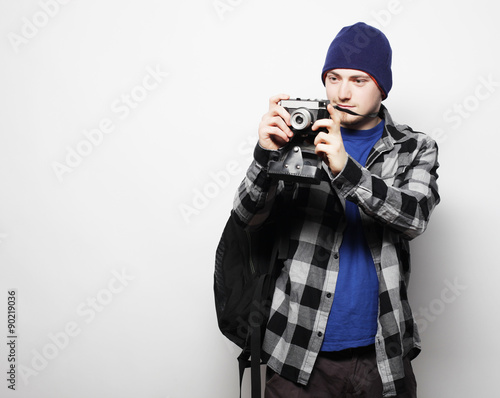 young  photographer over white background photo